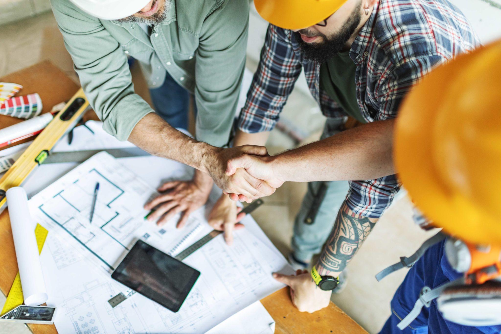 Roofing contractor reviewing project